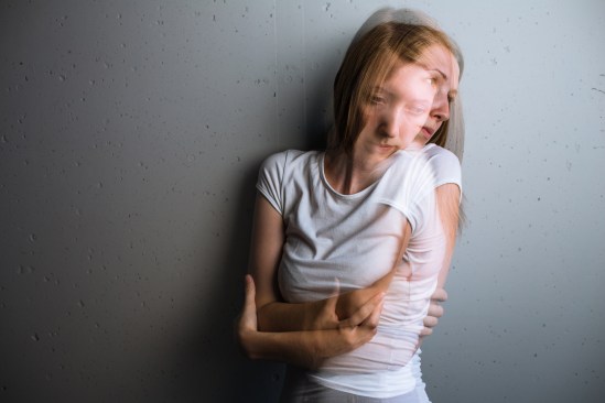 Young woman suffering from a severe depression/anxiety (color to